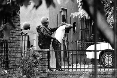 Albuquerque SWAT officers arrest a man at his home on drug and burglary charges - photo by Jeffry D. Scott/IMPACT VISUALS