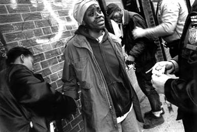 The drug war wich serves as justification for calling out SWAT, dispoportionately targets peoples of colour. Here a grandmother caught with a small quantity of drugs at a New York housing project faces serious jail time - Photo by Francisco L. Conde/IMPACT VISUALS